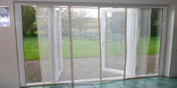 Large magnetic screen that self closes over a patio and french door 