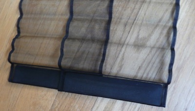 Flyscreen door panel with weight attached in charcoal